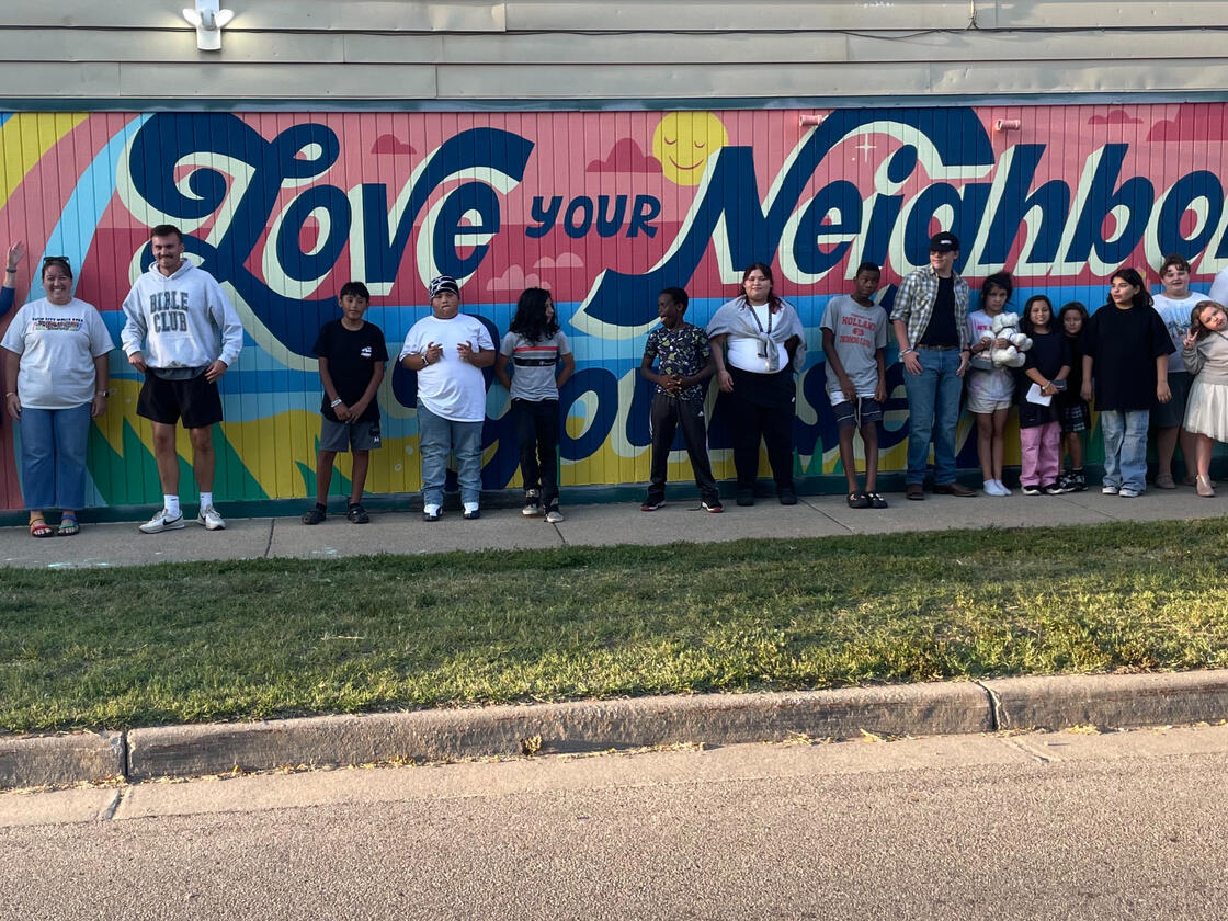 Posing in front of our new mural in Holland, MI!